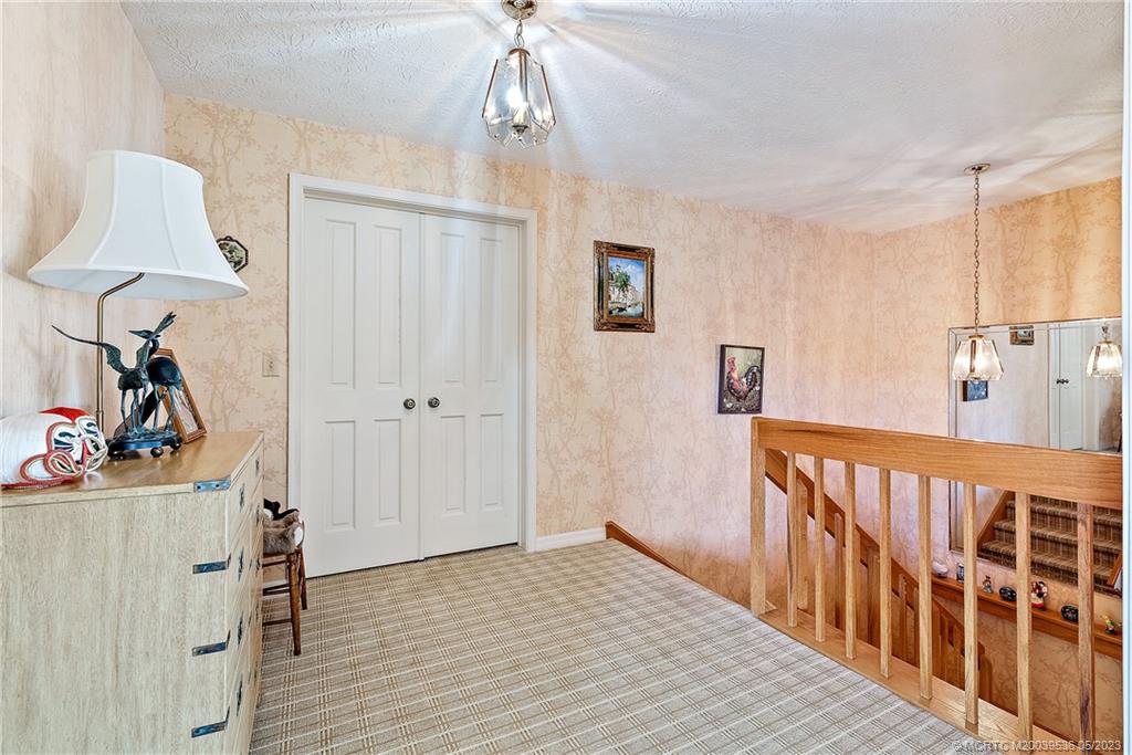 19 Island Road Sewall's Point, FL 34996 - Photo 44 of 50 a view of a room with furniture and wooden floor