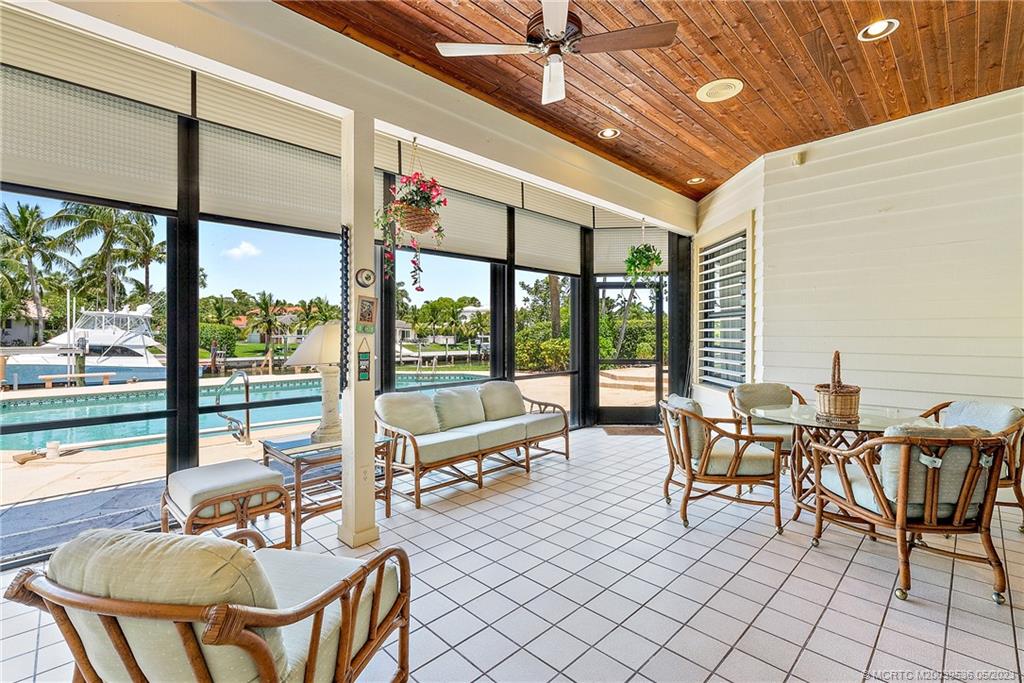 19 Island Road Sewall's Point, FL 34996 - Photo 47 of 50 a dining room with furniture water view and wooden floor