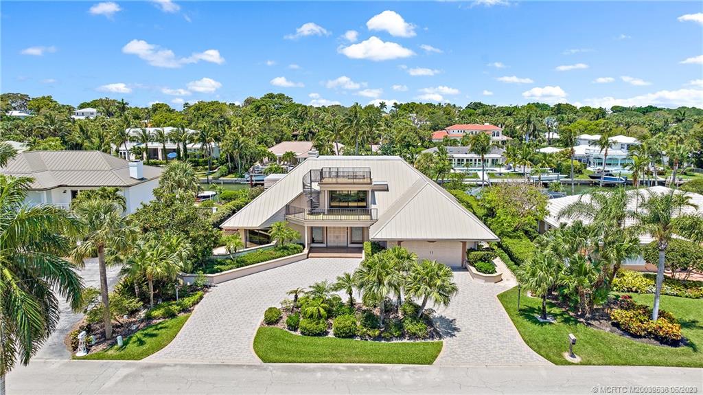 19 Island Road Sewall's Point, FL 34996 - Photo 6 of 50 a aerial view of a house with a yard and potted plants