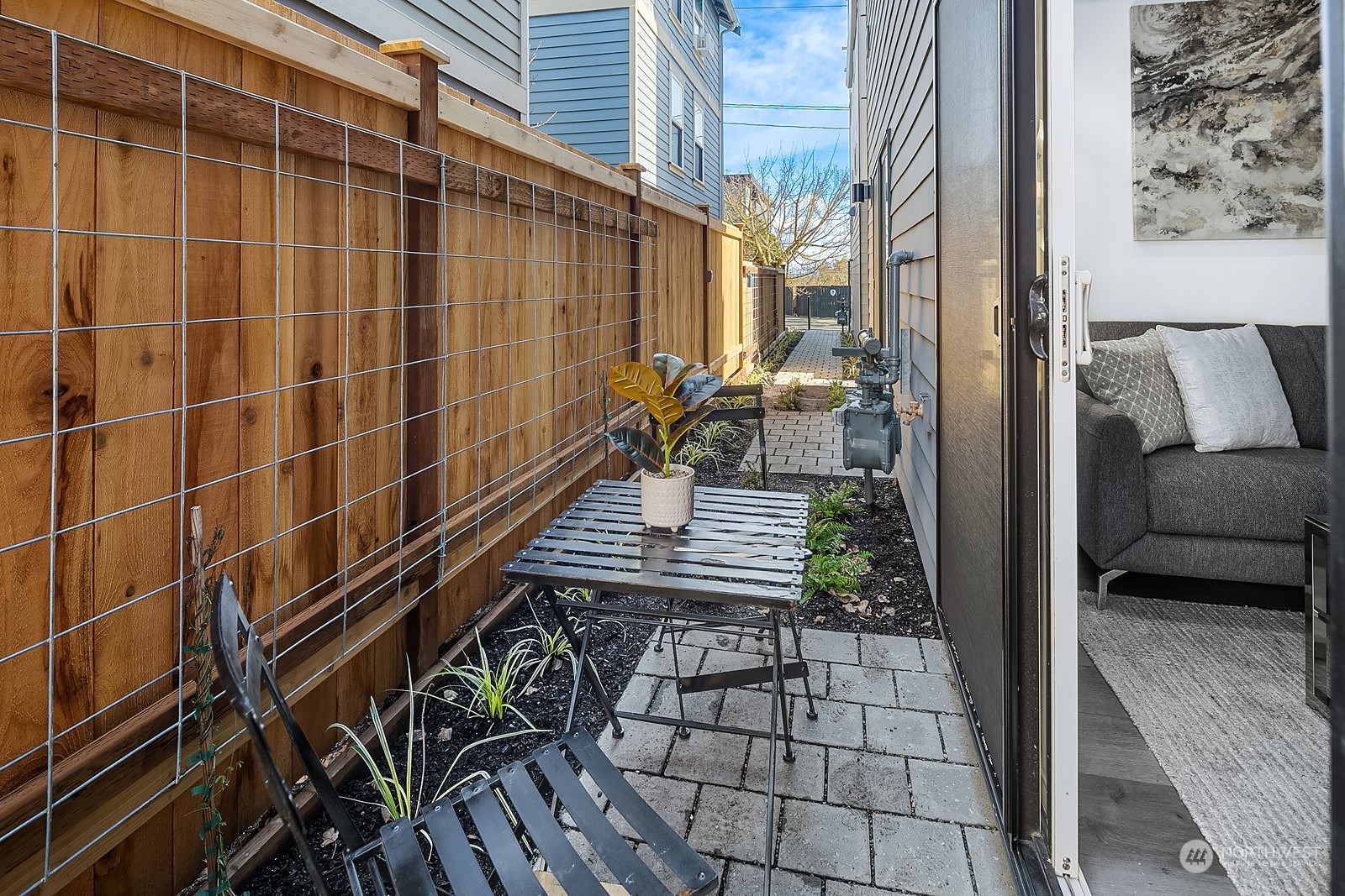 1123 D 18th Avenue Seattle, WA 98122 - Photo 13 of 22 a view of balcony with two chairs and a potted plant