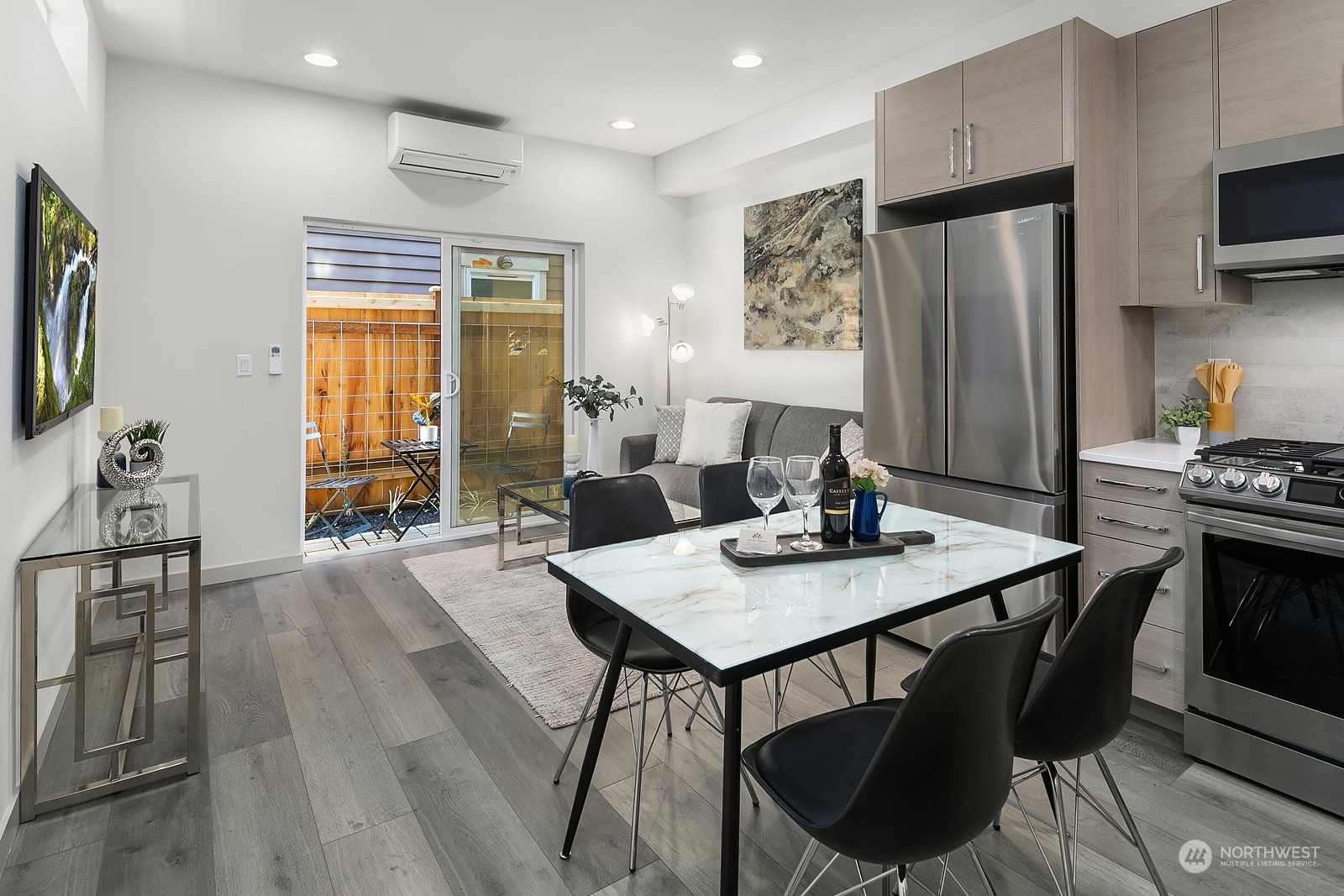 1123 D 18th Avenue Seattle, WA 98122 - Photo 4 of 22 a view of a dining room with furniture window and wooden floor