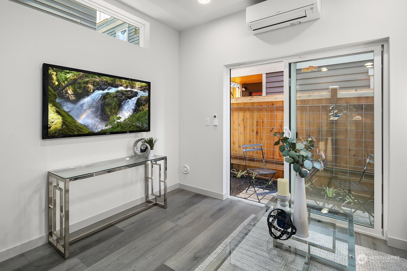 1123 D 18th Avenue Seattle, WA 98122 - Photo 6 of 22 a view of a livingroom with wooden floor and a flat screen tv