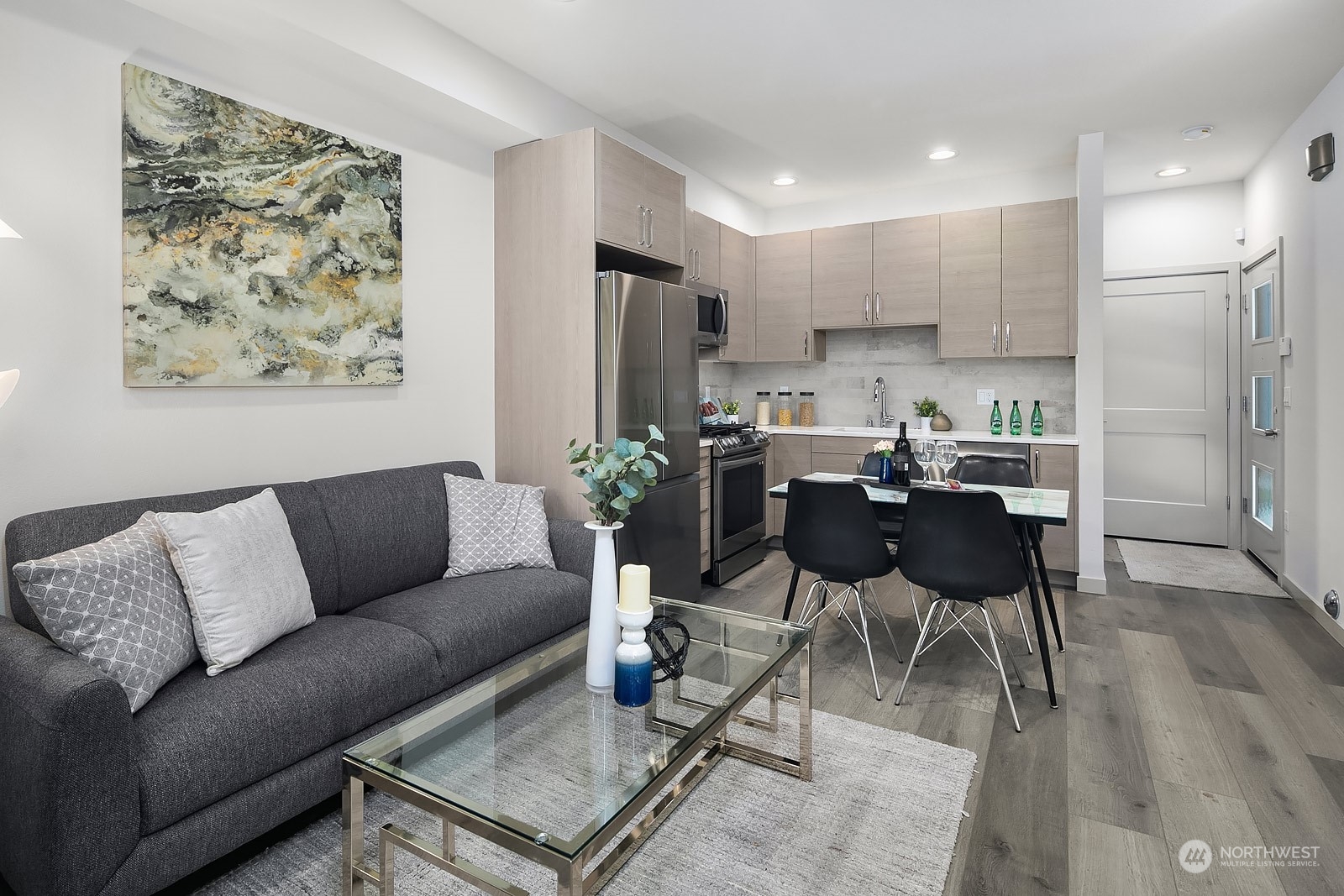 1123 D 18th Avenue Seattle, WA 98122 - Photo 7 of 22 a living room with furniture kitchen view and a refrigerator