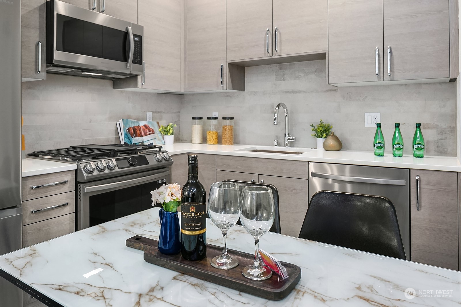 1123 D 18th Avenue Seattle, WA 98122 - Photo 9 of 22 a kitchen with a stove and white cabinets