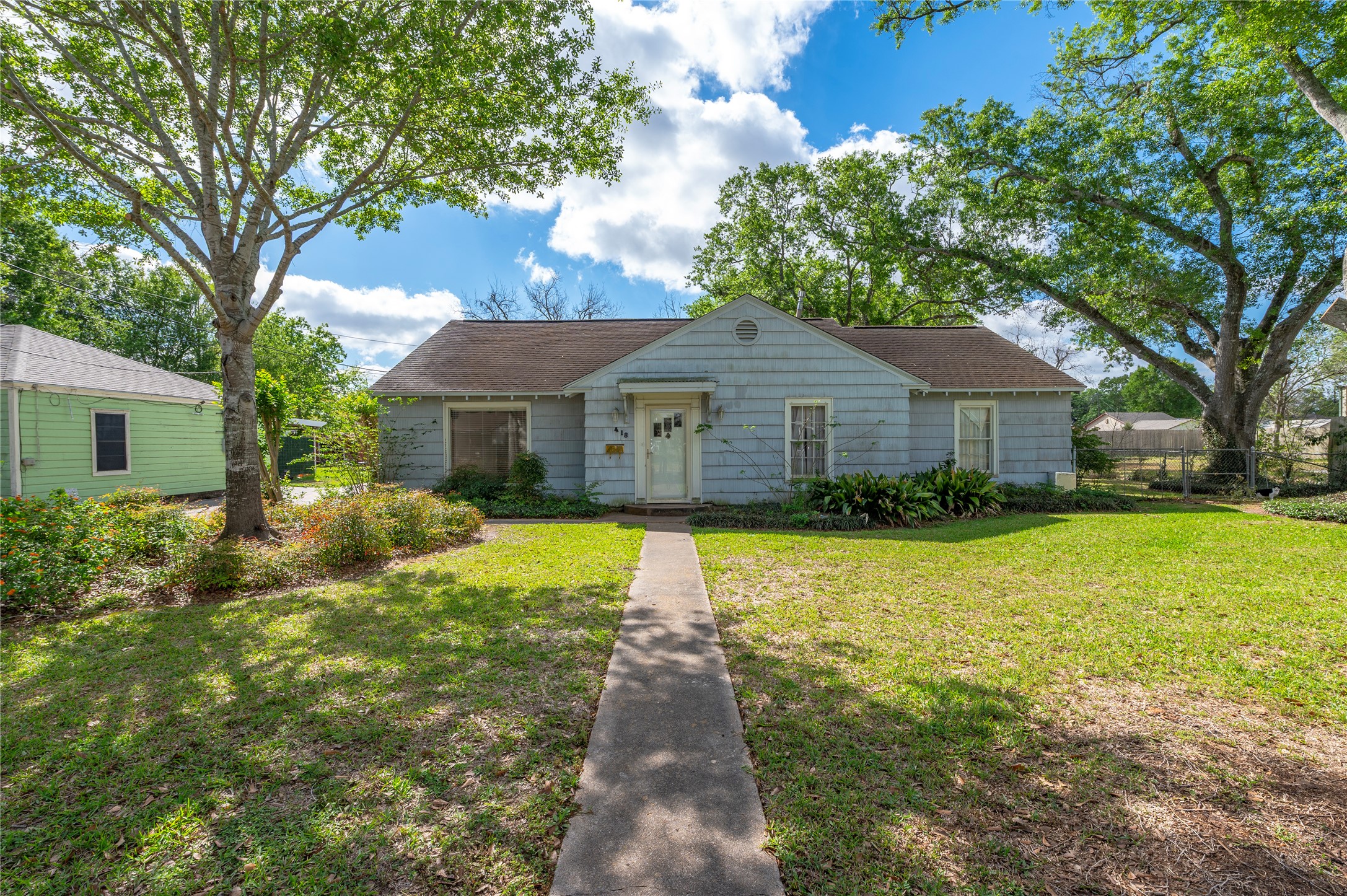 418 East Strand Street El Campo, TX 77437 - Photo 18 of 20 a front view of a house with yard patio and green space