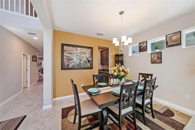 a dining room with furniture and window