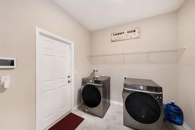a utility room with dryer and washer