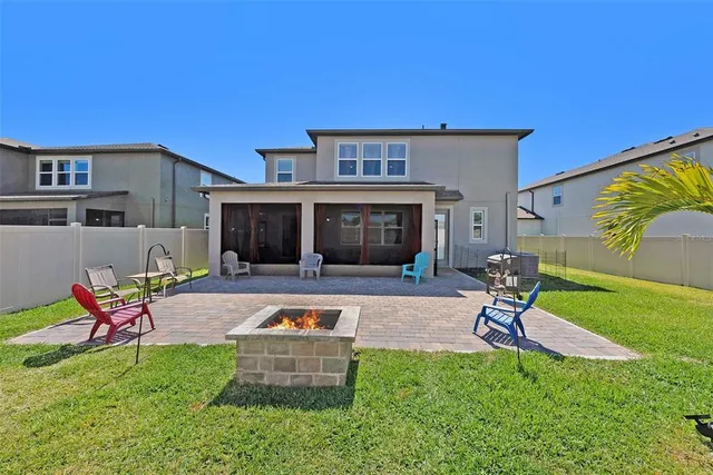 a white bench sitting in front of a house