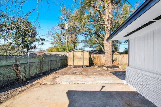 a view of a backyard of the house