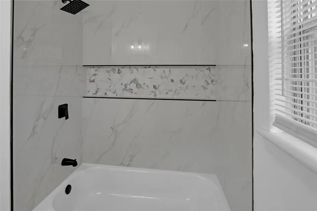 a bathroom with a bathtub