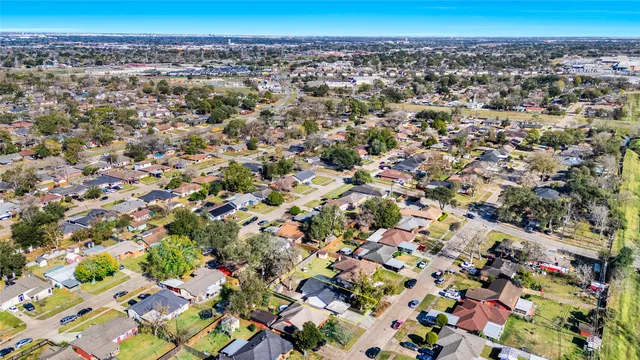 an aerial view of residential houses with swimming pool