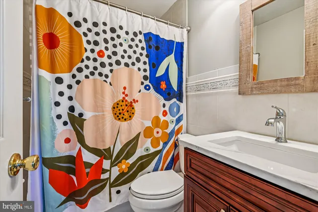 a view of a room with window and wooden floor