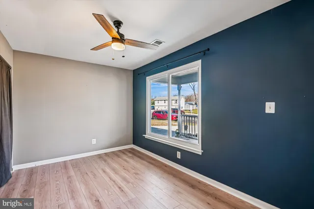 a view of an empty room with a window