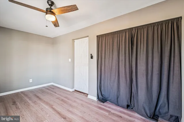 a bathroom with a sink mirror and toilet