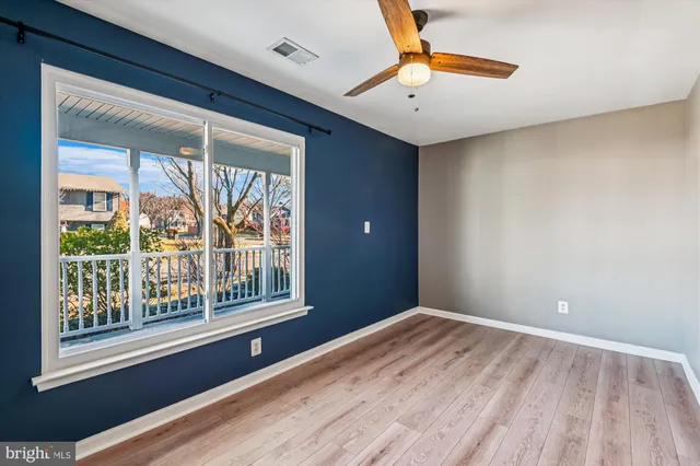 a bathroom with a granite countertop sink a toilet and a shower