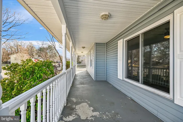 a car parked in front of a brick house next to a yard