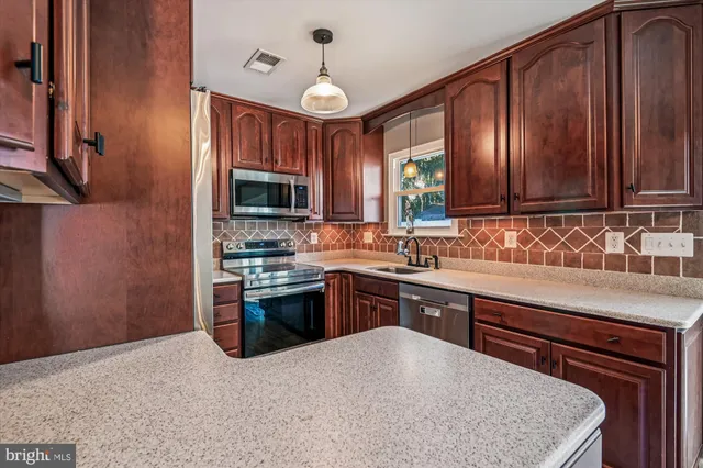 a view of a room with wooden floor and door