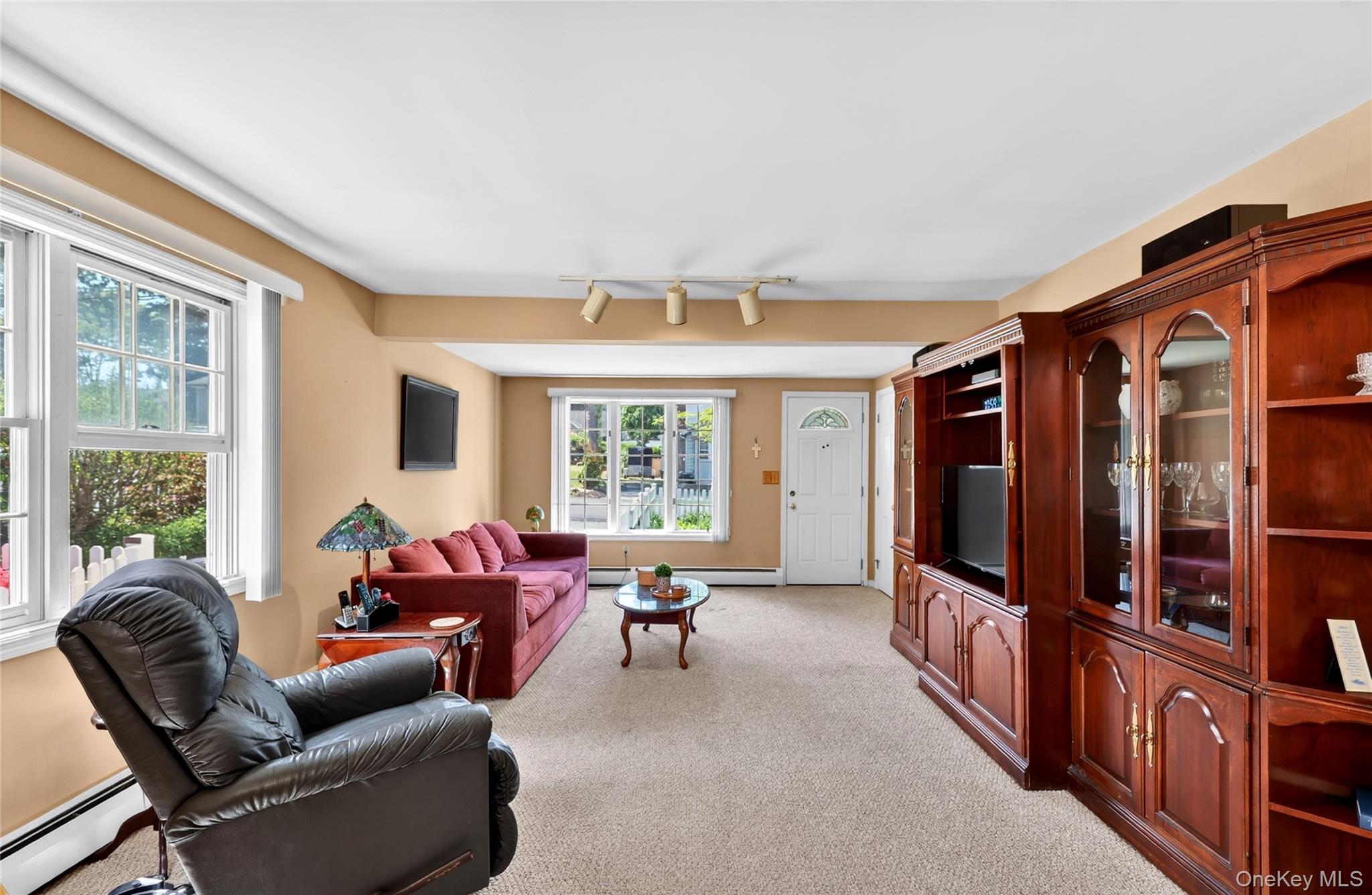 232 Cherry Road Yorktown Heights, NY 10598 - Photo 4 of 21 a living room with furniture ceiling fan and a window