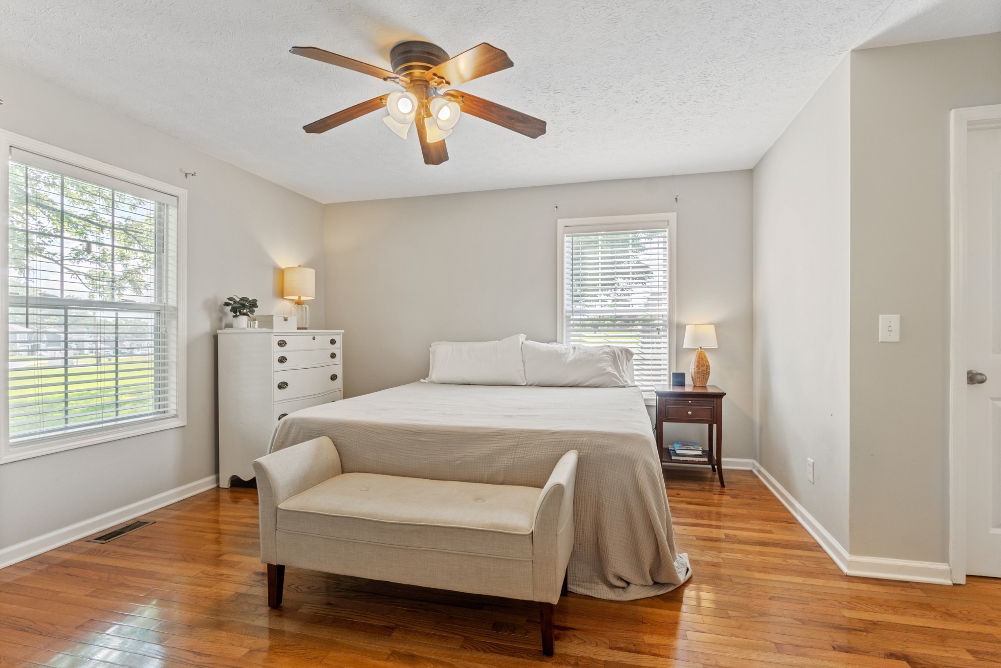 105 South Palmers Chapel Road White House, TN 37188 - Photo 30 of 42 Bedroom four, the master suite, is located on the main level. Offers loads of natural light, his and her closets and gleaming hardwood floors.