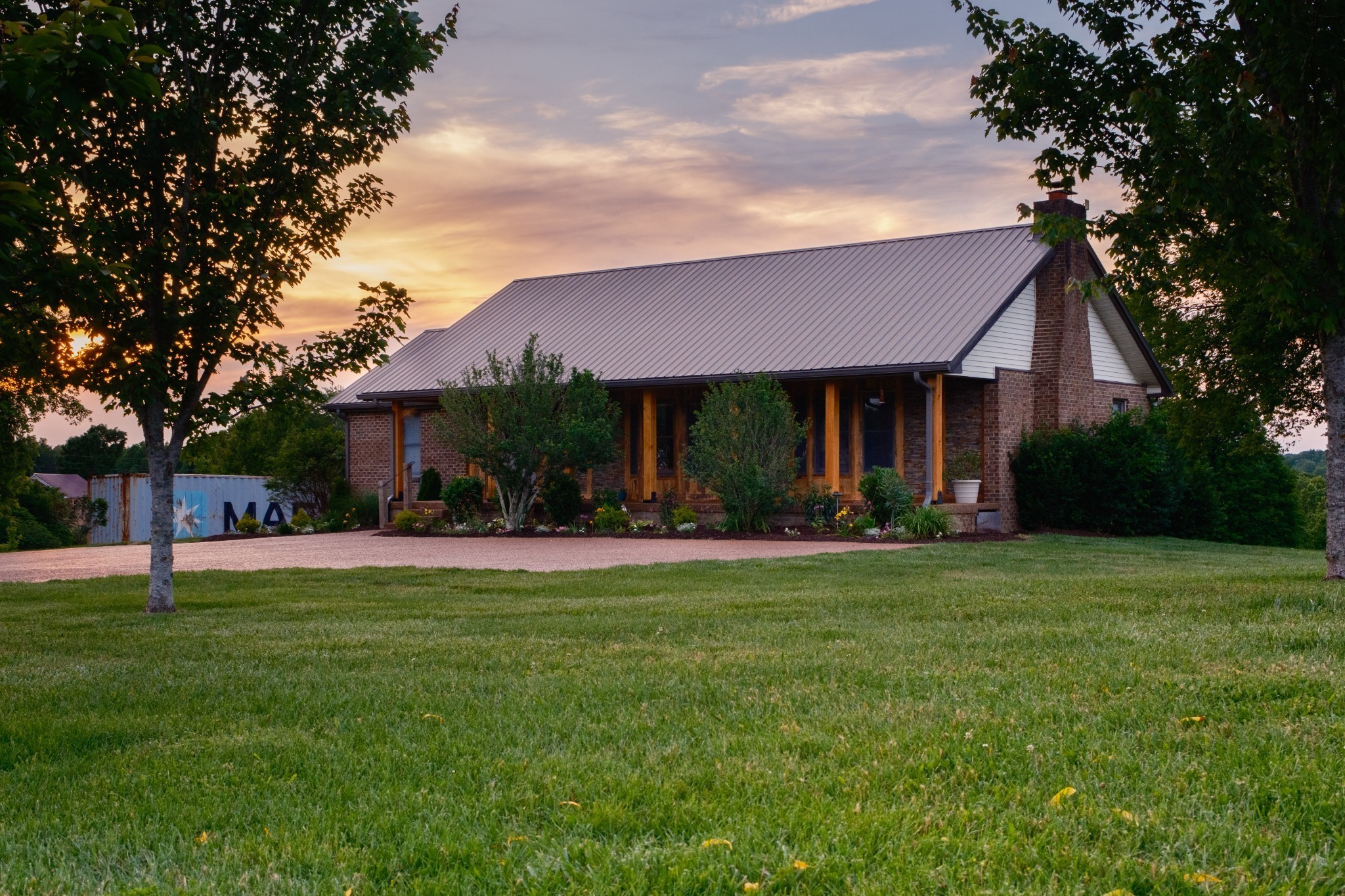 5956 Greenbriar Road Franklin, TN 37064 - Photo 17 of 41 a front view of a house with a garden