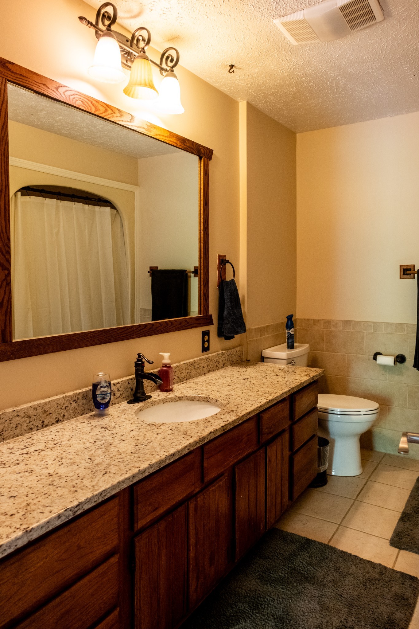 5956 Greenbriar Road Franklin, TN 37064 - Photo 27 of 41 a bathroom with a granite countertop sink and a mirror