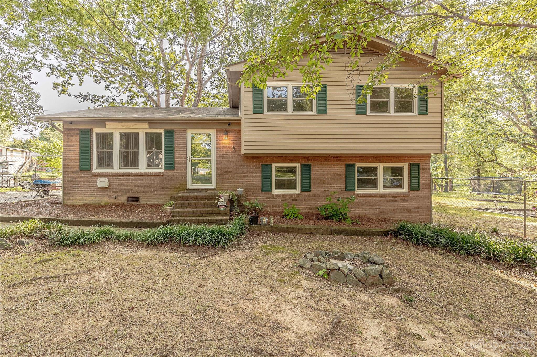 1702 Carson Street Monroe, NC 28110 - Photo 1 of 29 front view of a house with a yard