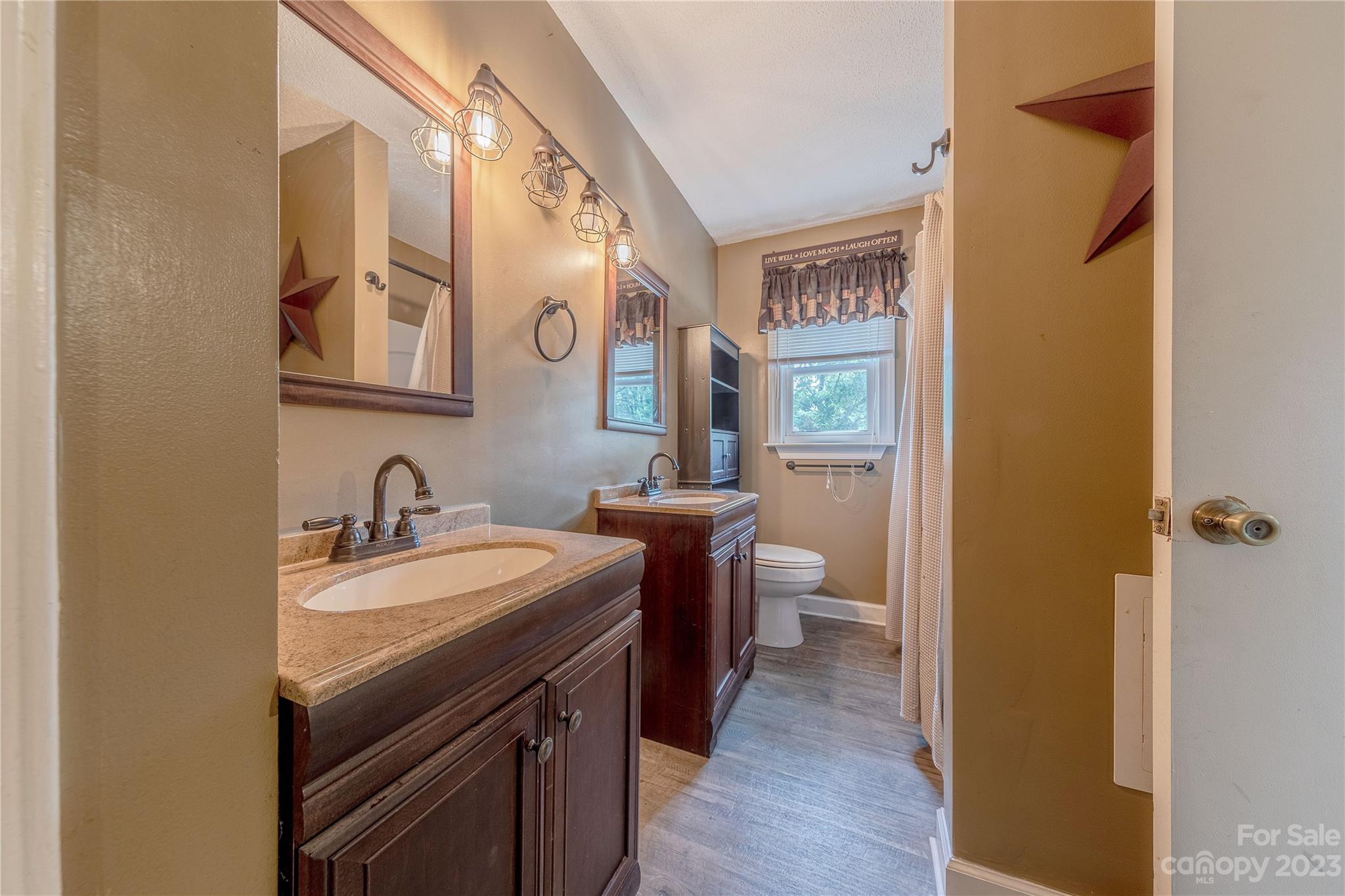 1702 Carson Street Monroe, NC 28110 - Photo 20 of 29 a bathroom with a sink and a mirror