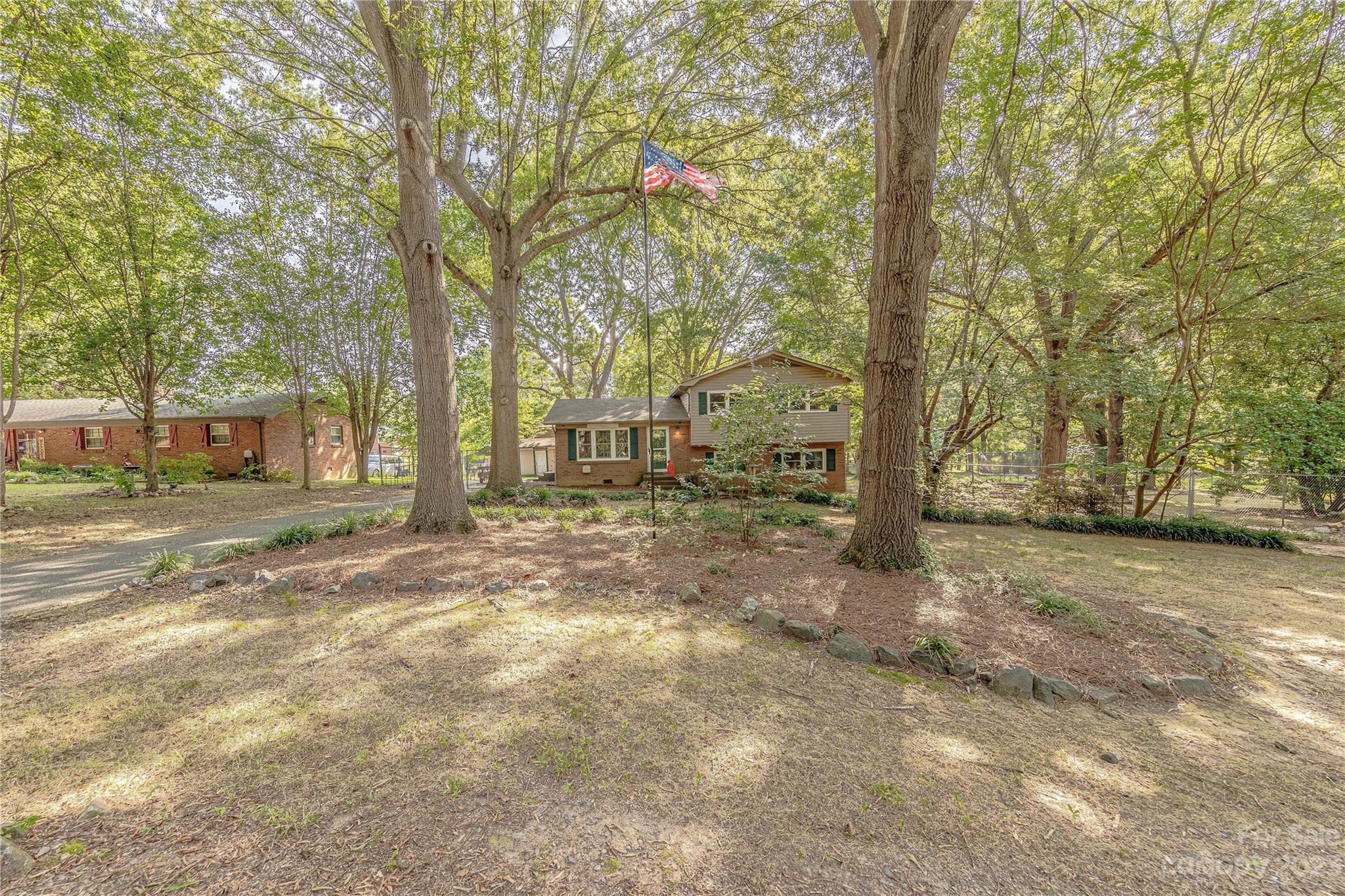 1702 Carson Street Monroe, NC 28110 - Photo 25 of 29 a view of a yard with trees