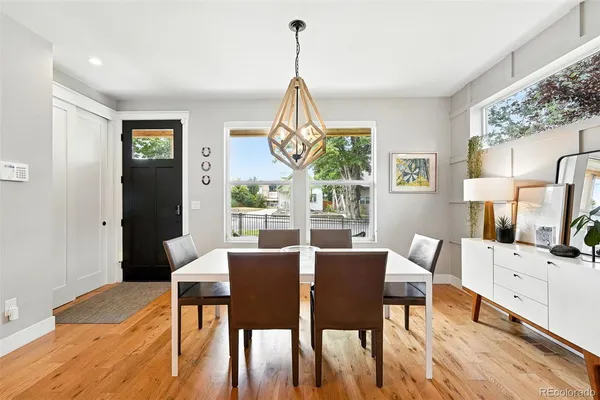 a view of a dining room with furniture window and wooden floor
