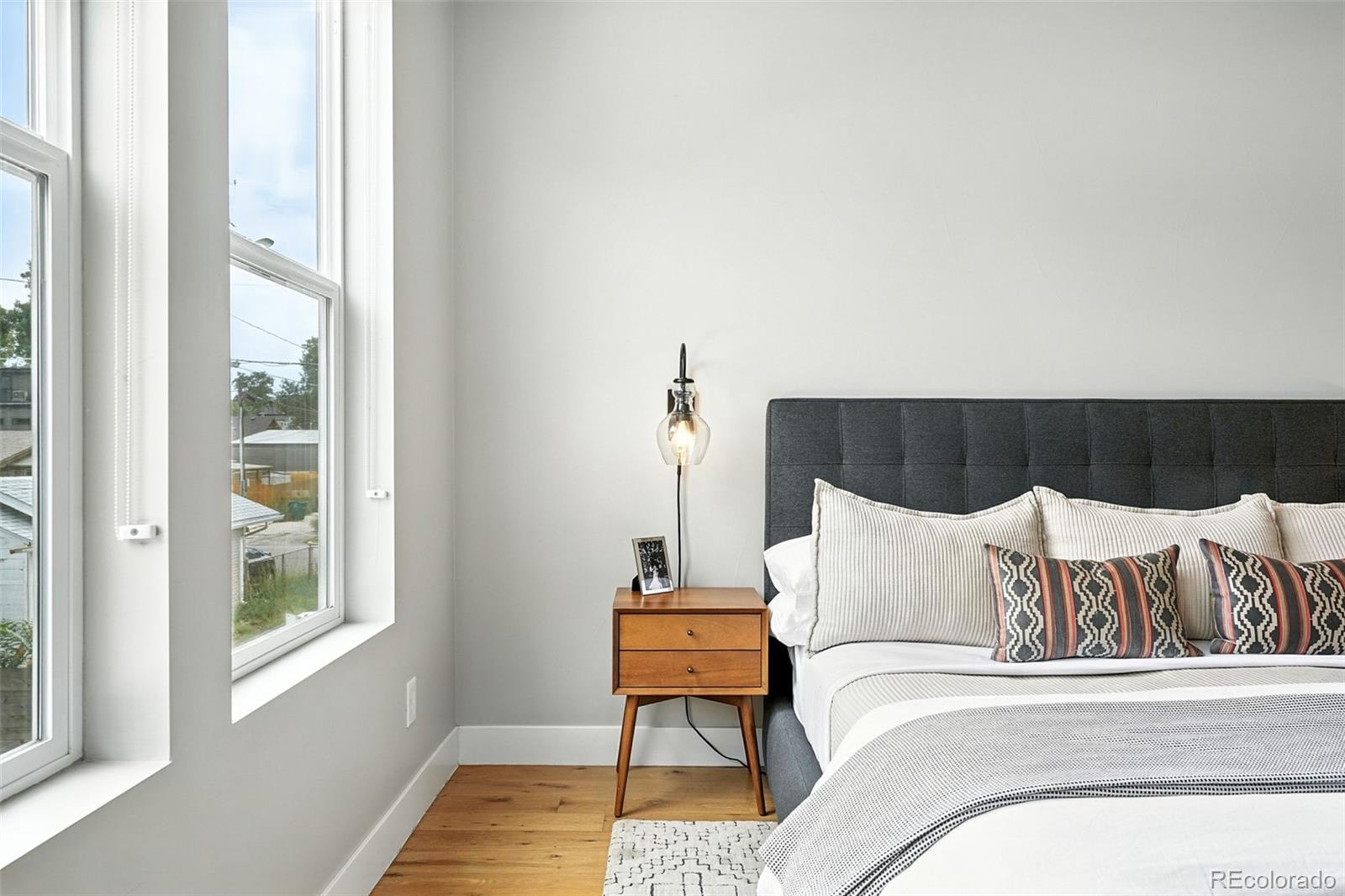 4516 Stuart Street Denver, CO 80212 - Photo 25 of 46 a bedroom with a bed and a window