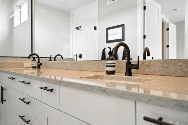 a bathroom with sink and mirror