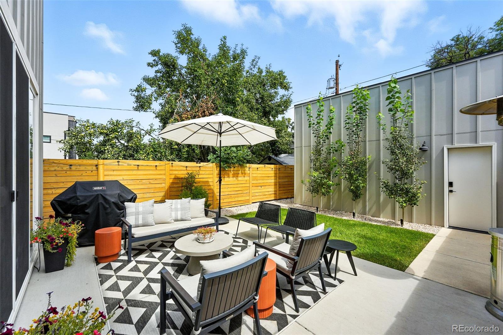 4516 Stuart Street Denver, CO 80212 - Photo 31 of 46 a view of a patio with furniture and a yard