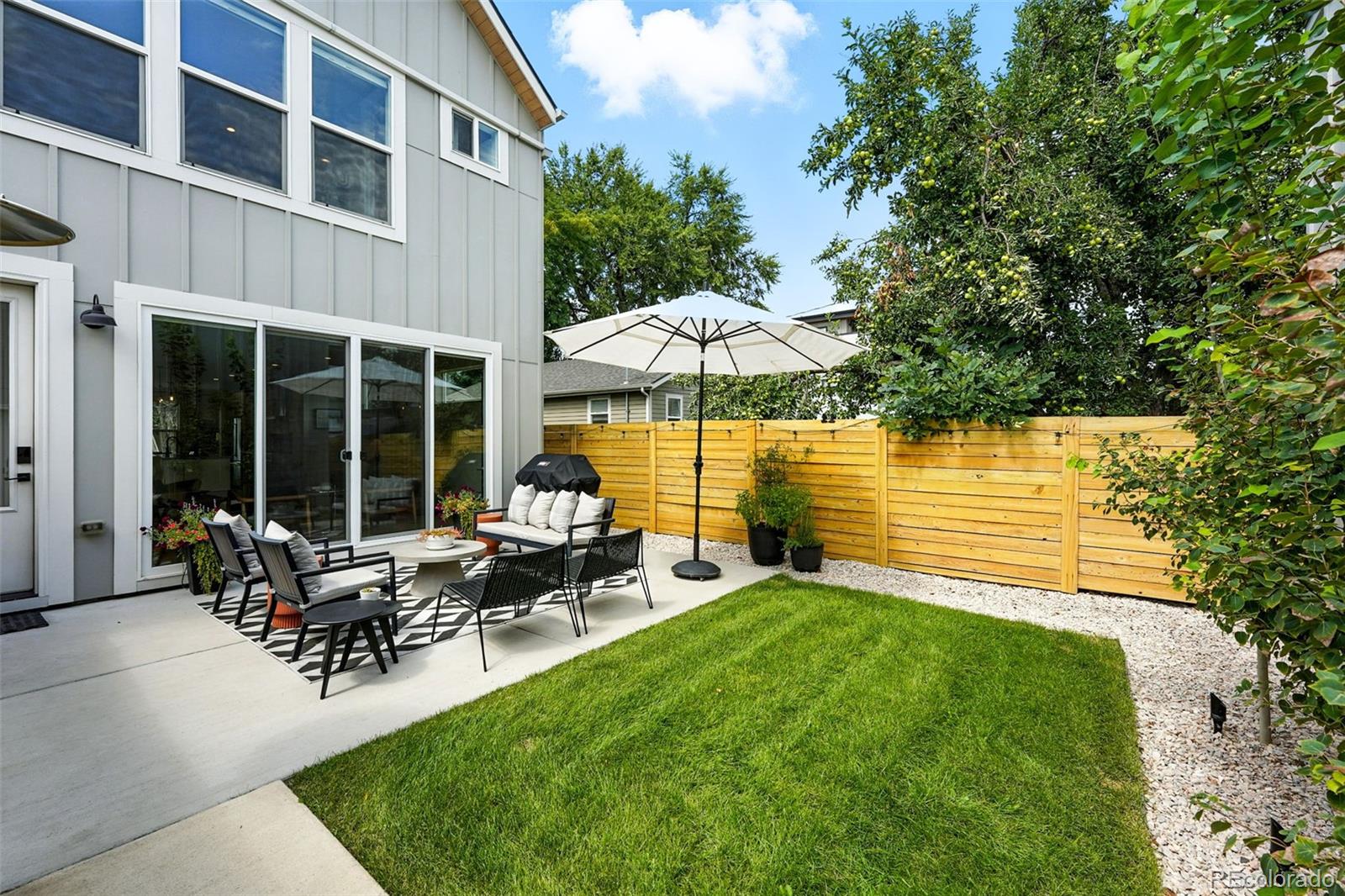 4516 Stuart Street Denver, CO 80212 - Photo 34 of 46 a view of a house with sitting area and garden