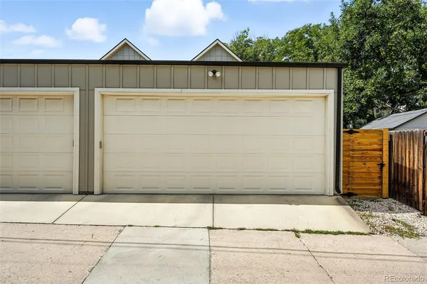 a view of house with wooden fence