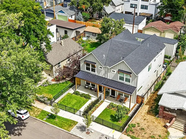 an aerial view of a house with a big yard