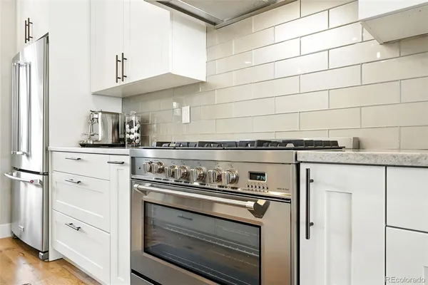 a kitchen with cabinets and appliances