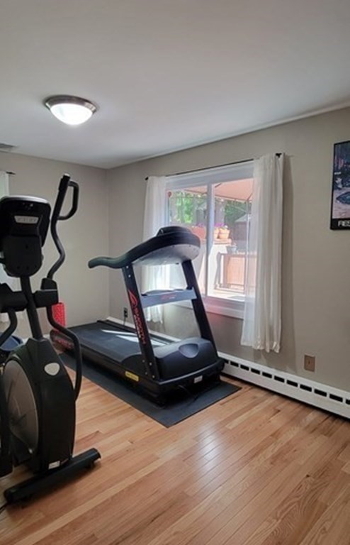 22 Ledgewood Road Wakefield, MA 01880 - Photo 13 of 34 a room with gym equipment and wooden floor