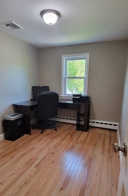 22 Ledgewood Road Wakefield, MA 01880 - Photo 14 of 34 a living room with furniture and a wooden floor