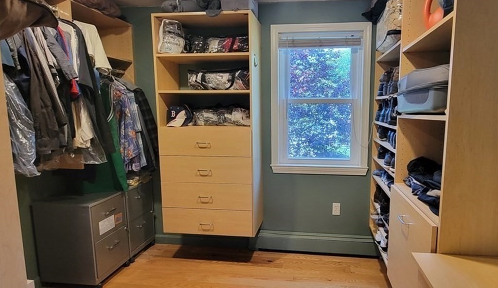 22 Ledgewood Road Wakefield, MA 01880 - Photo 18 of 34 a view of walk in closet with clothes and shoes