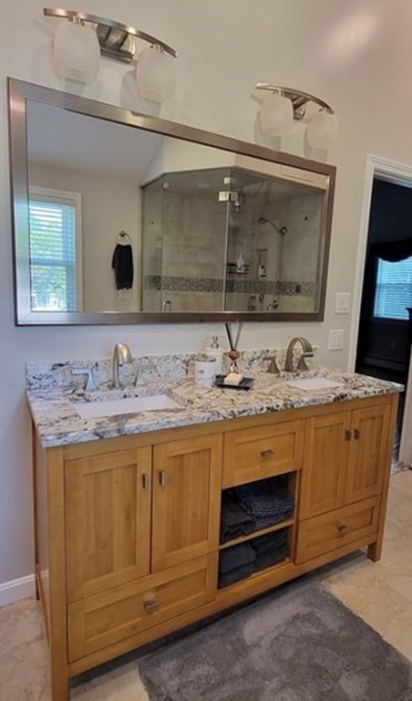 22 Ledgewood Road Wakefield, MA 01880 - Photo 20 of 34 a bathroom with a granite countertop sink a mirror and a