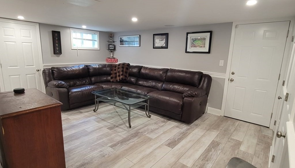 22 Ledgewood Road Wakefield, MA 01880 - Photo 25 of 34 a living room with furniture and a wooden floor