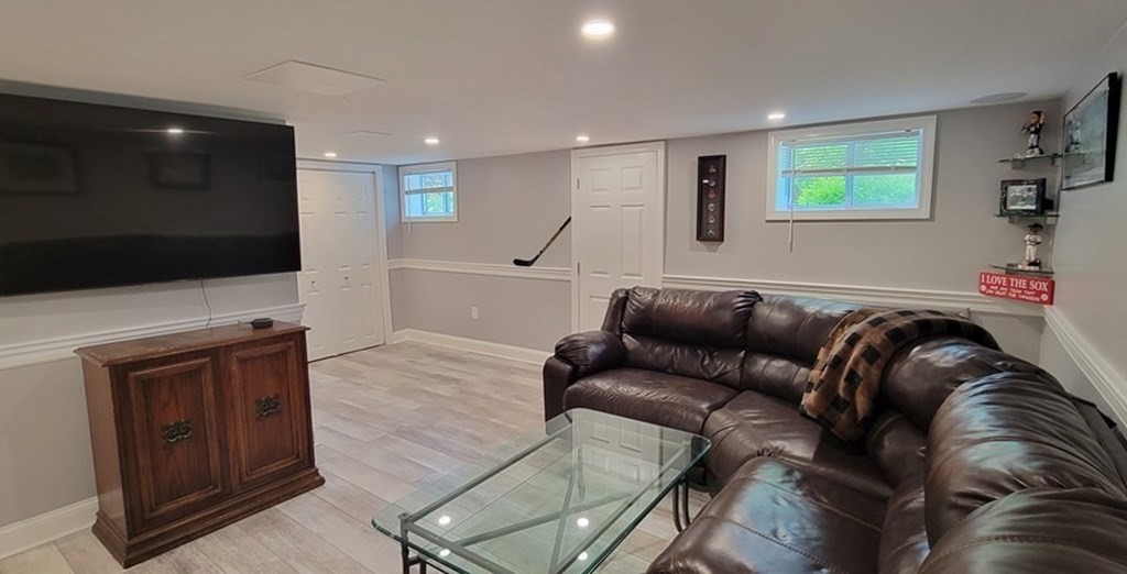 22 Ledgewood Road Wakefield, MA 01880 - Photo 26 of 34 a living room with furniture and a flat screen tv