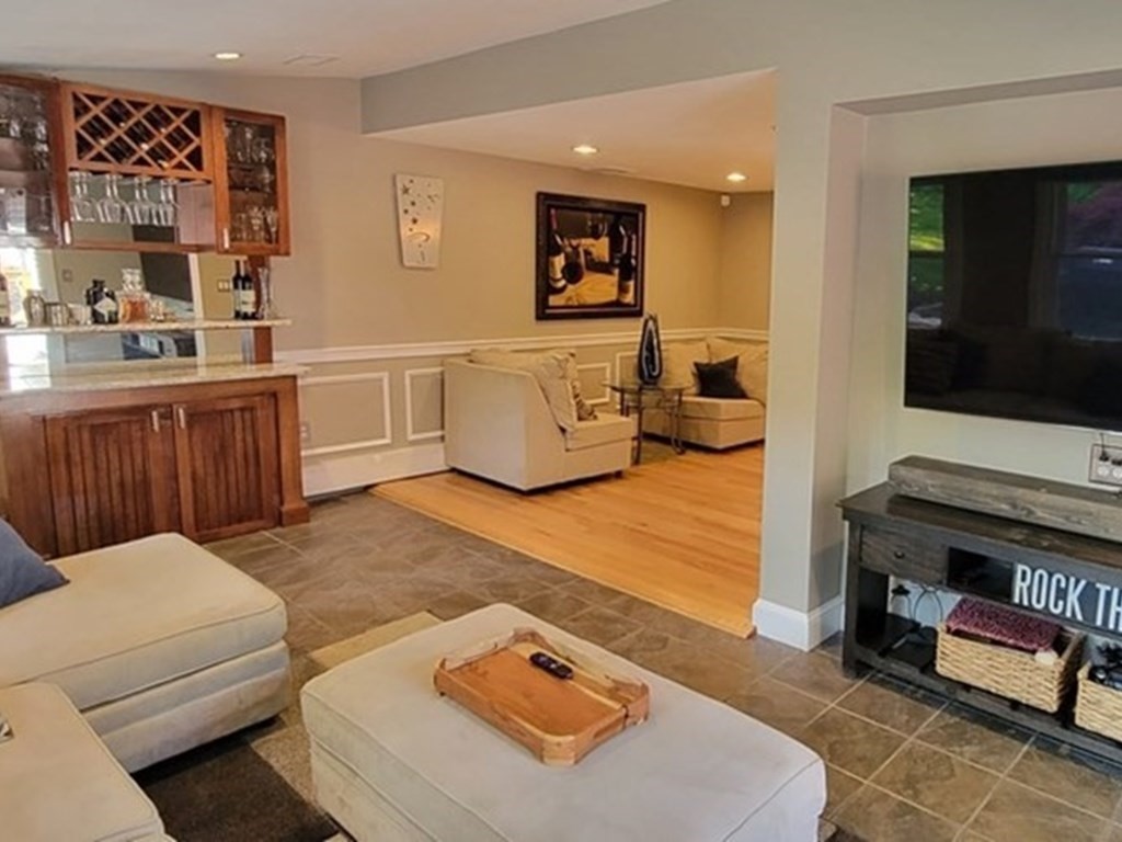 22 Ledgewood Road Wakefield, MA 01880 - Photo 4 of 34 a living room with furniture and a flat screen tv