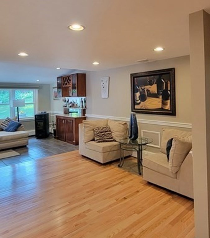22 Ledgewood Road Wakefield, MA 01880 - Photo 5 of 34 a living room with furniture and a flat screen tv