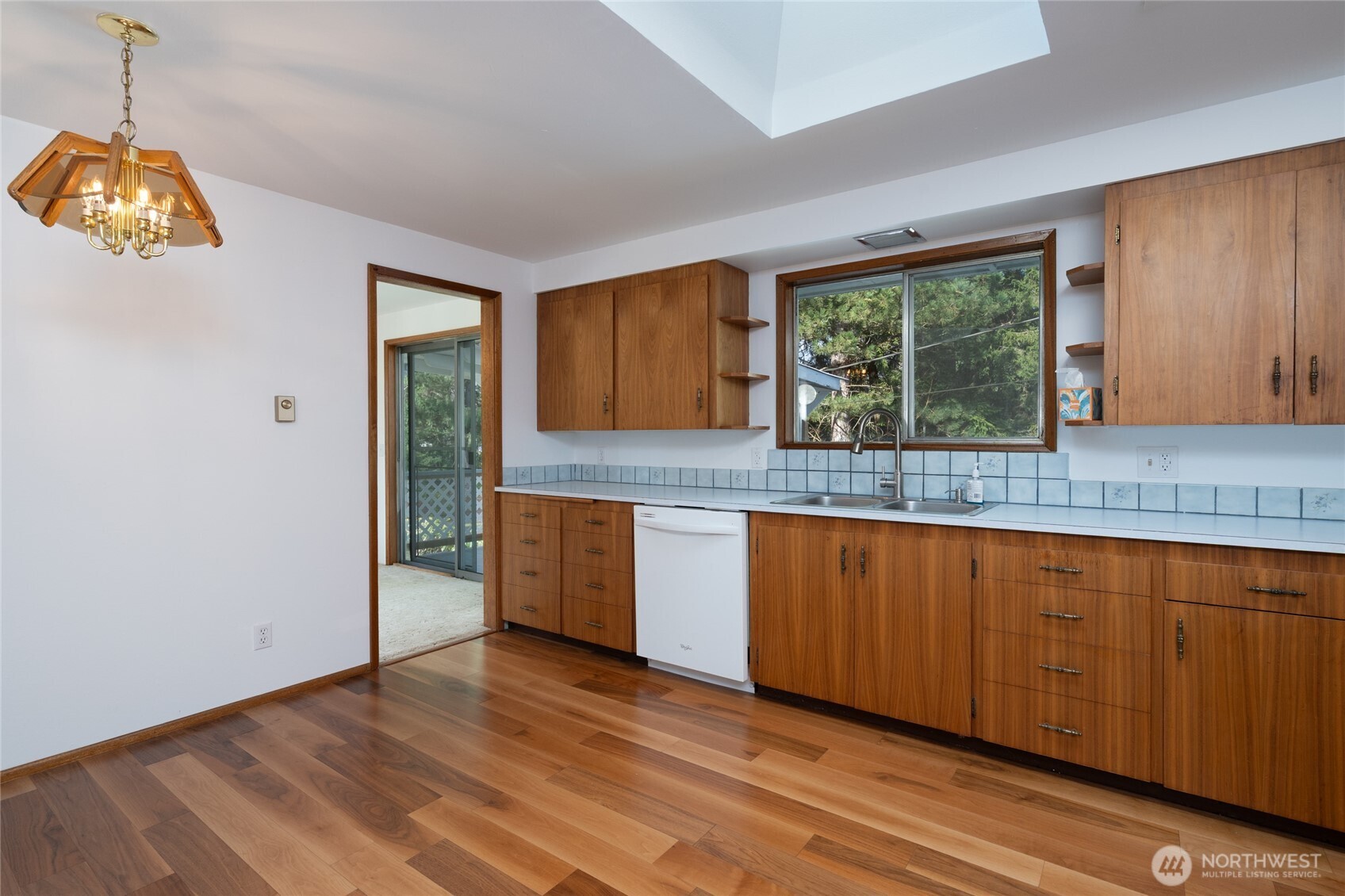 22491 Grip Road Sedro-Woolley, WA 98284 - Photo 23 of 40 a kitchen with granite countertop wooden floors a sink and a window