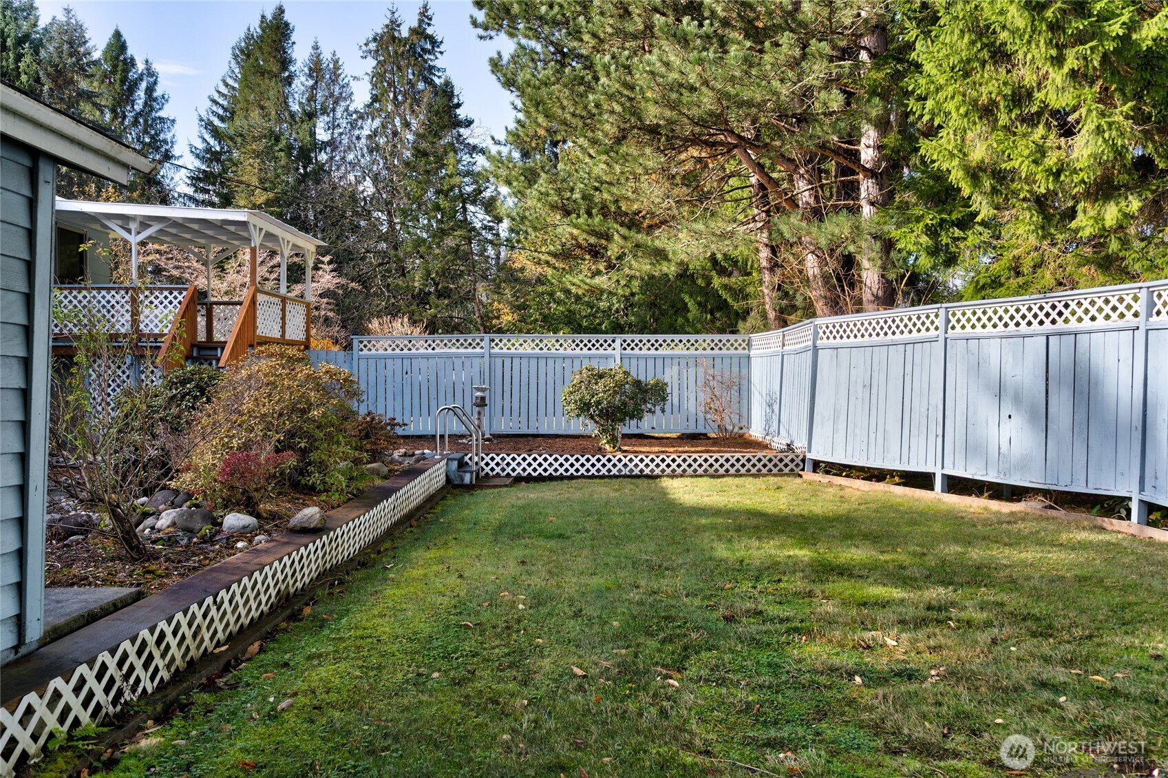 22491 Grip Road Sedro-Woolley, WA 98284 - Photo 30 of 40 a view of a backyard with wooden fence