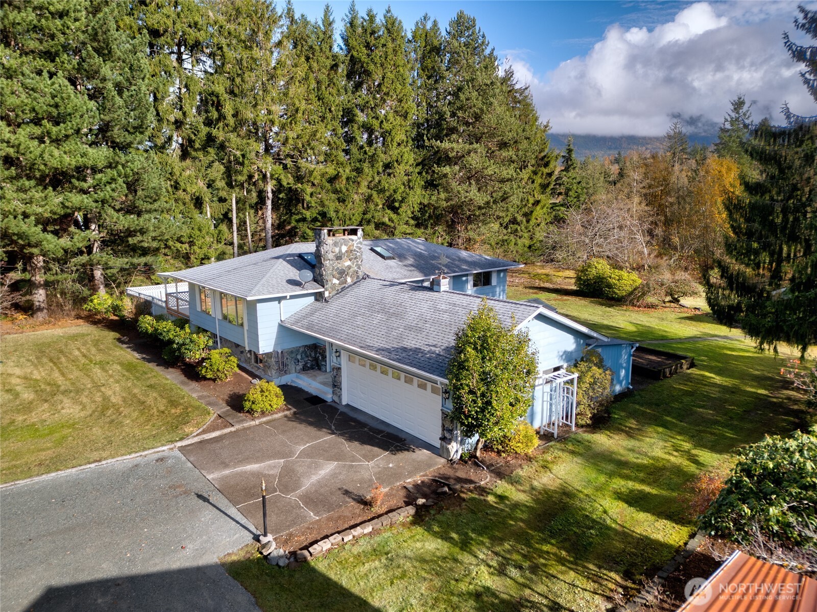 22491 Grip Road Sedro-Woolley, WA 98284 - Photo 3 of 40 an aerial view of a house with yard swimming pool and outdoor seating