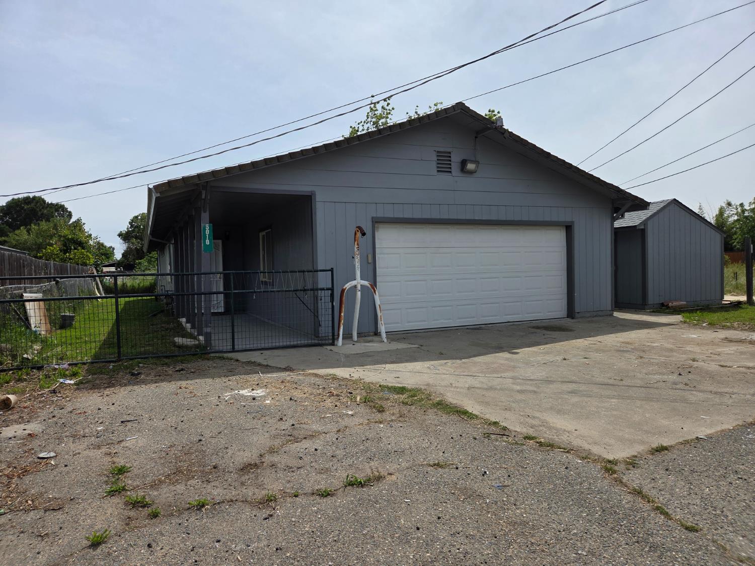 5010 Powerline Road, Unit D Olivehurst, CA 95961 - Photo 2 of 12 a front view of a house with a yard and garage