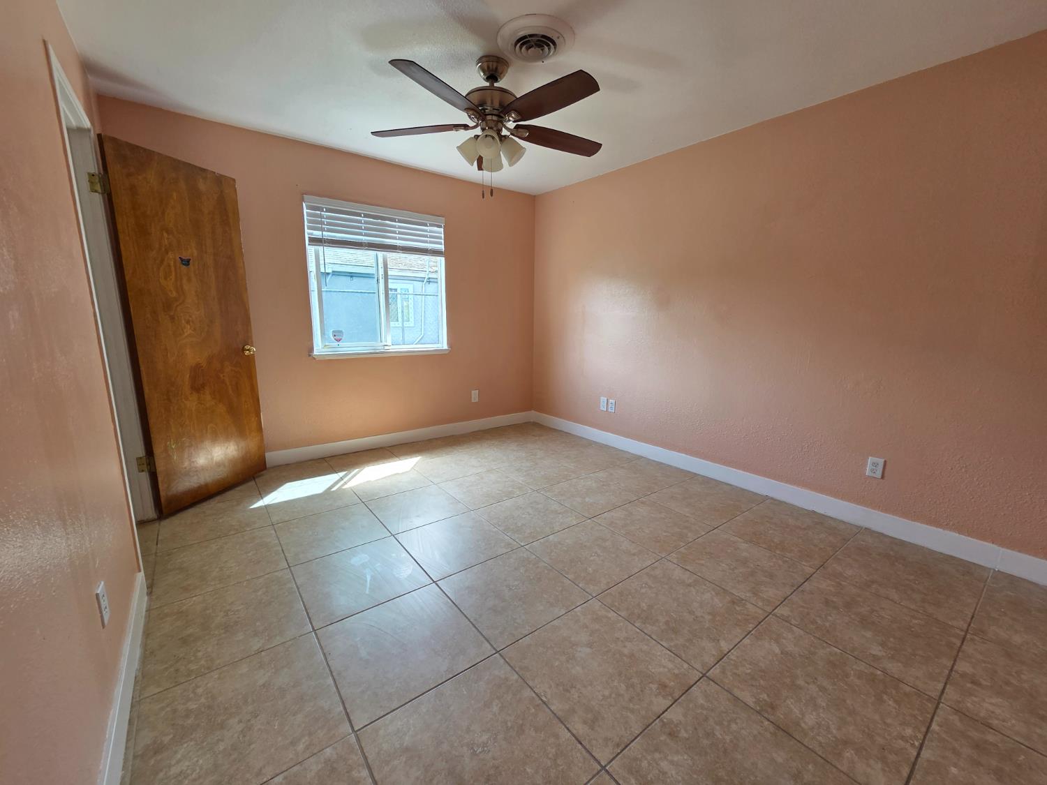 5010 Powerline Road, Unit D Olivehurst, CA 95961 - Photo 10 of 12 an empty room with windows and fan