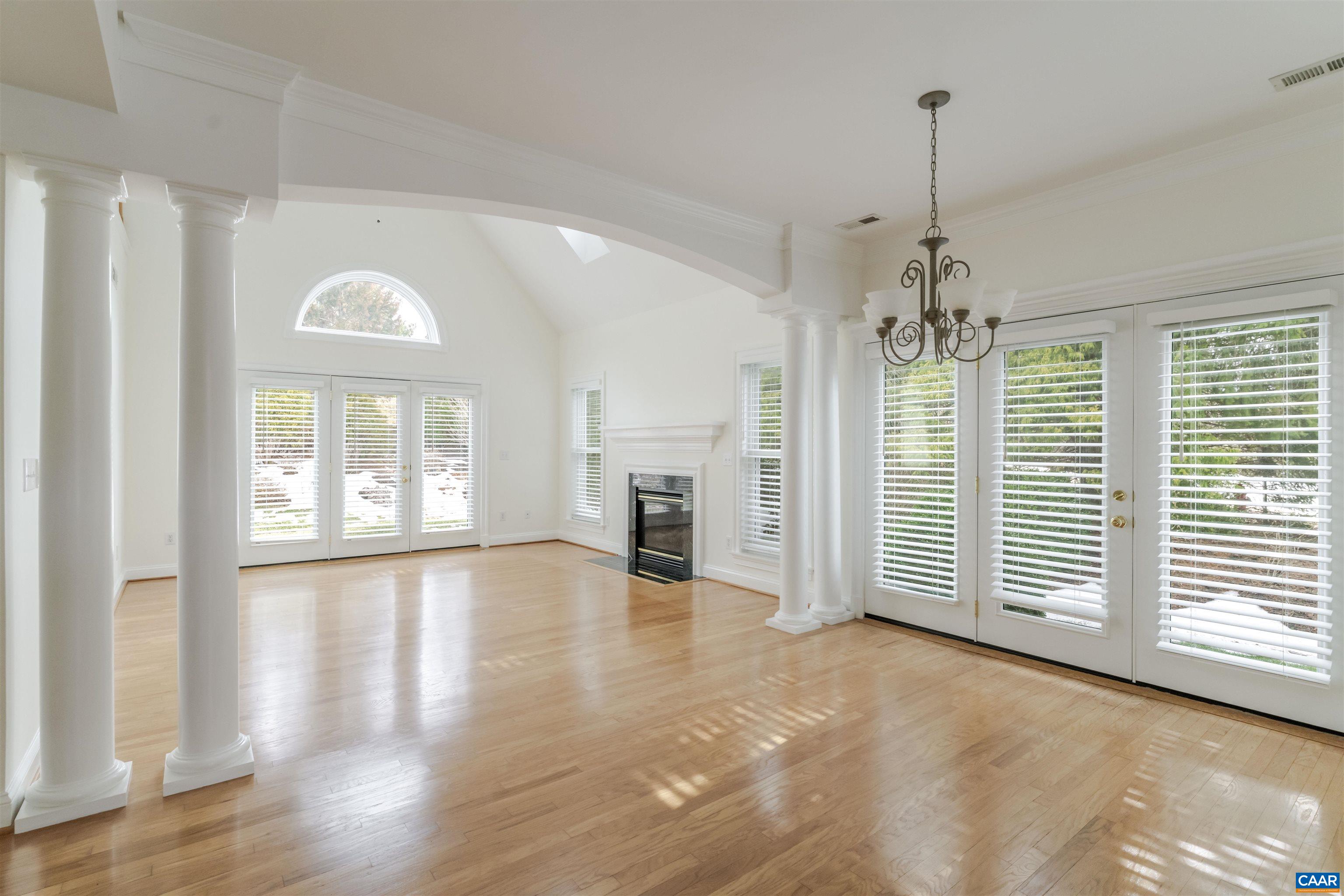 Dining Room, which is adjacent to the living room, with exterior doors leading to private outside area.